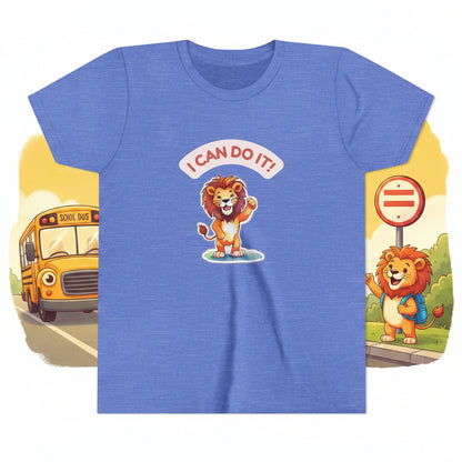 Blue t-shirt with a cartoon lion and 'I Can Do It!' text on a white background with a yellow school bus ad a young lion waiting at the bus stop