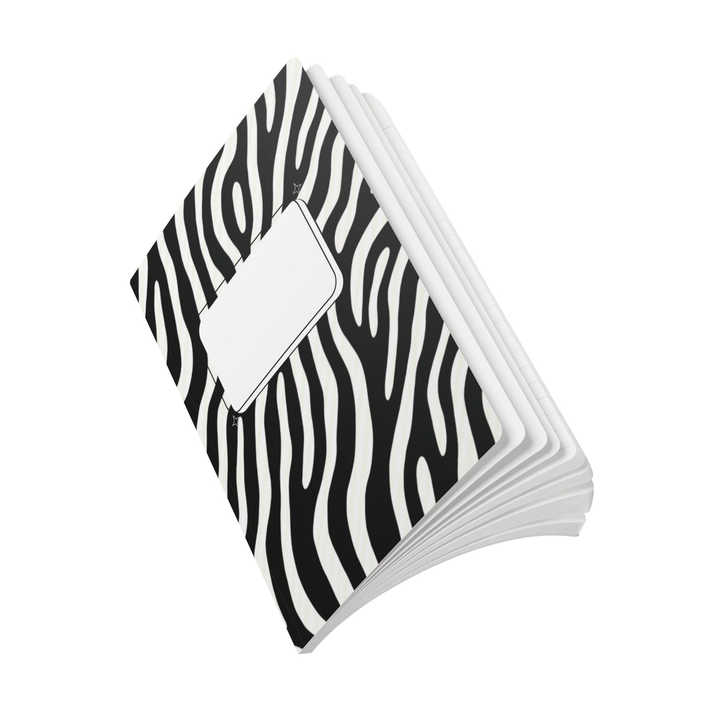 Stack of black and white zebra patterned notebooks on a white background