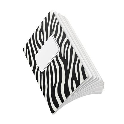 Stack of black and white zebra patterned notebooks on a white background