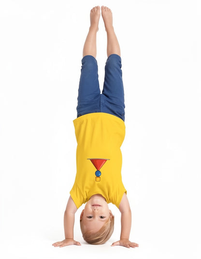 A child wearing a bright yellow t-shirt and blue shorts is performing a handstand against a solid white background.