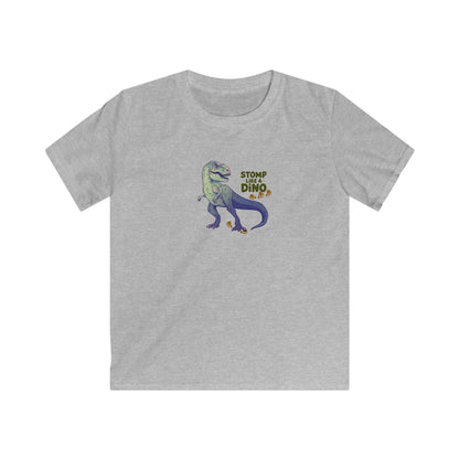 A heather gray short-sleeve crewneck t-shirt featuring a cartoon graphic of a purple and green dinosaur with the text 'STOMP LIKE A DINO' printed on the chest.