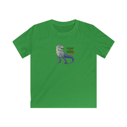 A green short-sleeve crewneck t-shirt featuring a cartoon graphic of a purple and gray T-Rex dinosaur with the text 'STOMP ALL DINO' in orange and yellow, displayed on a solid white background.
