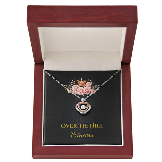 Pink roses topping the crown pendant in an elegant mahogany-style box.