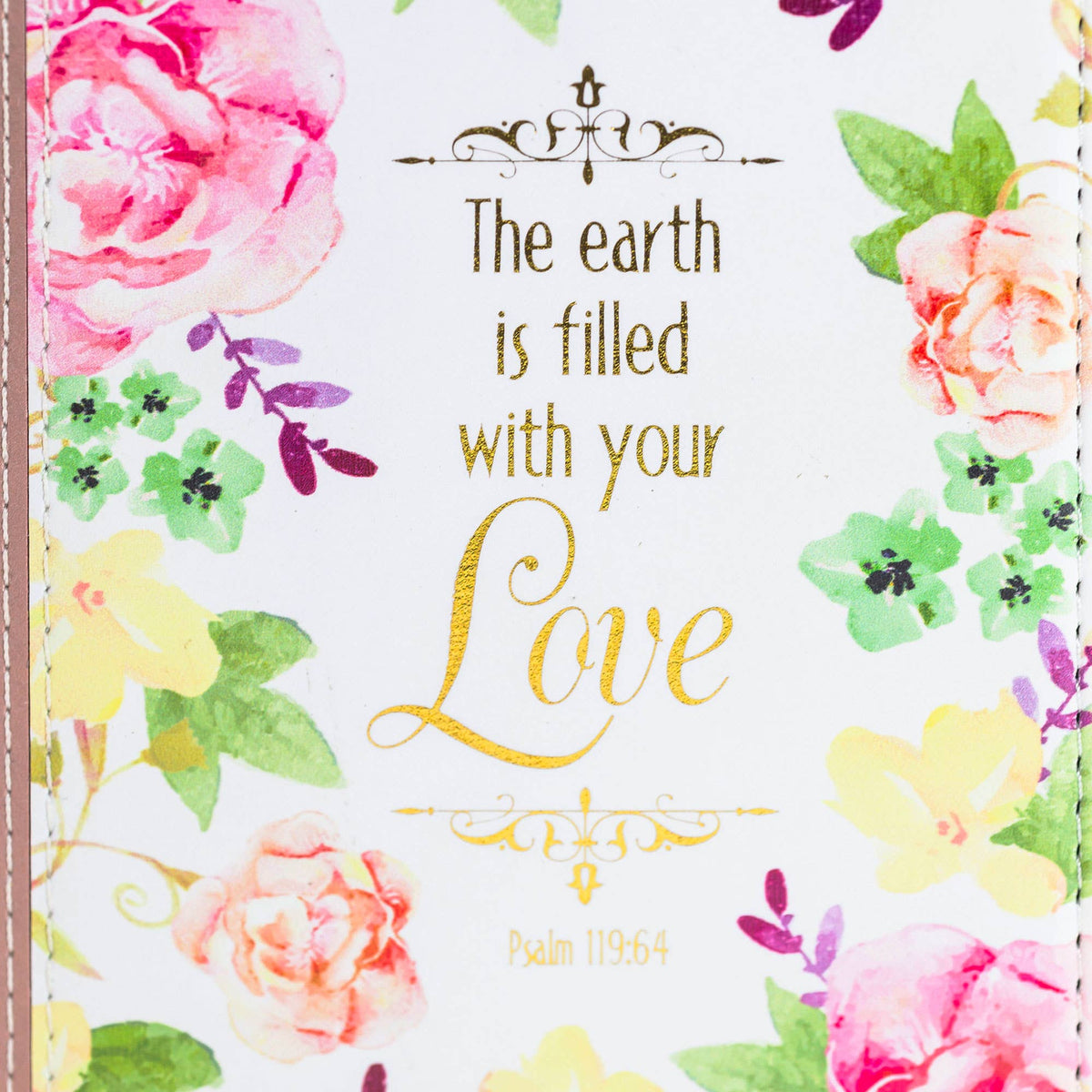 Floral design with 'The earth is filled with your love' text on a white background of journal cover.
