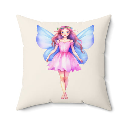 Cream Pillow with a  pink dress blue wings fairy design on a white background