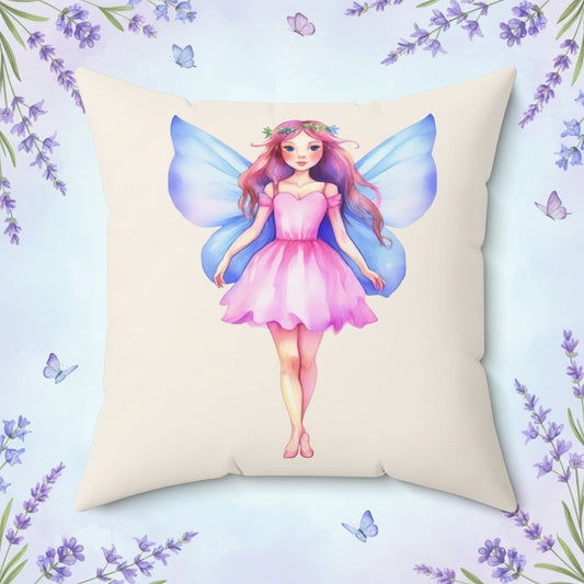 Cream Pillow with a  pink dress blue wings fairy design on a white background
