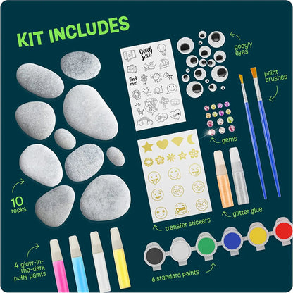 White river rocks with glow‑in‑the‑dark paints, glitter glue, brushes, and stickers arranged for crafting.