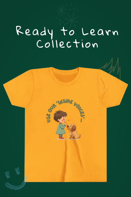 Ready to learn collection written on chalkboard. Mustard youth t-shirt graphic says use your inside voice.